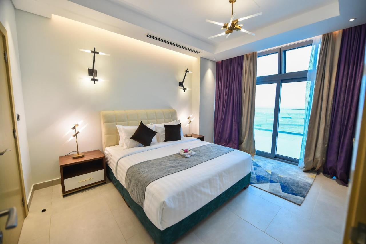 Waterfront Hotel Apartment Lusail Esterno foto A bedroom at the hotel