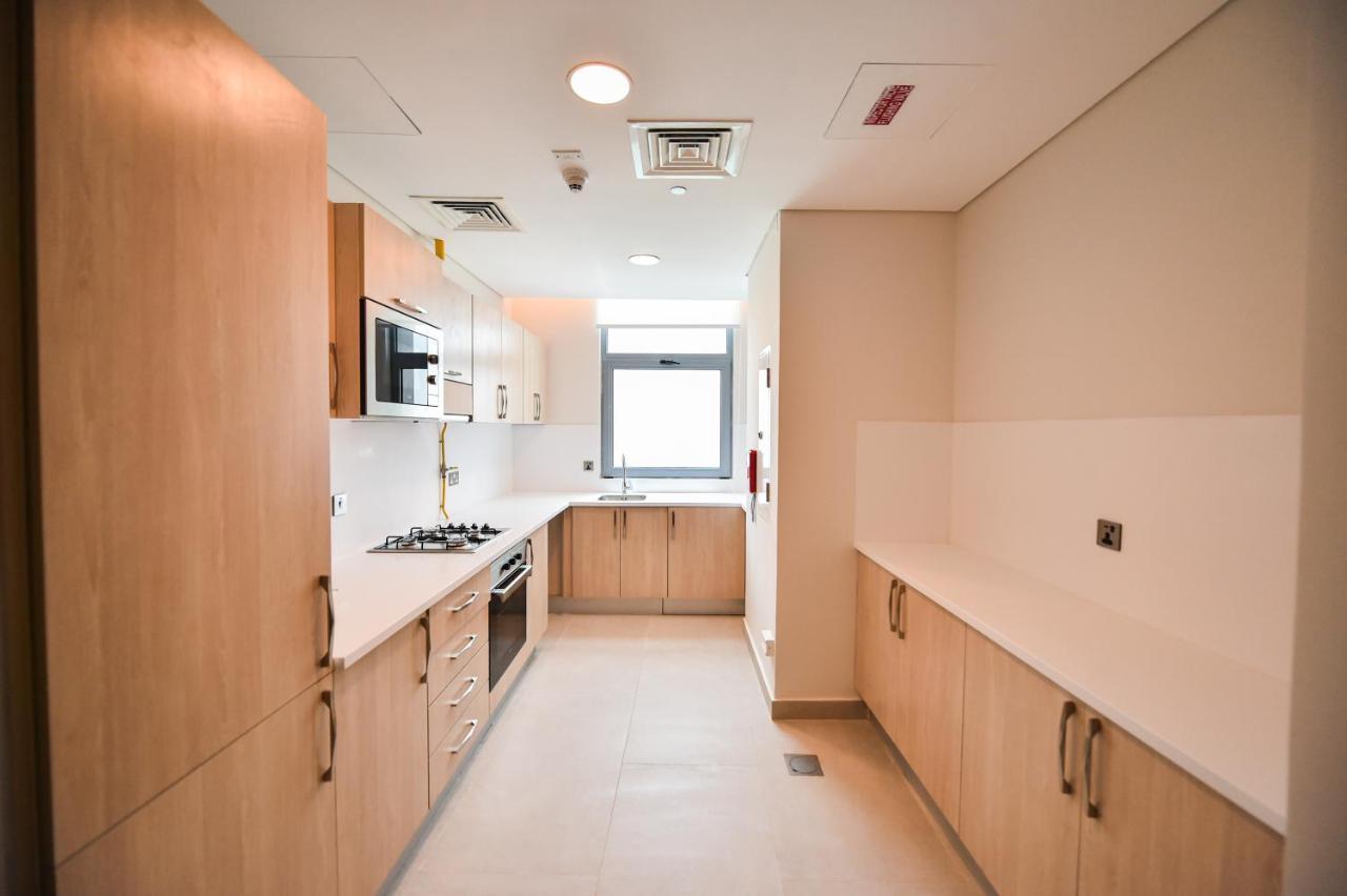 Waterfront Hotel Apartment Lusail Esterno foto A typical kitchen in a student flat