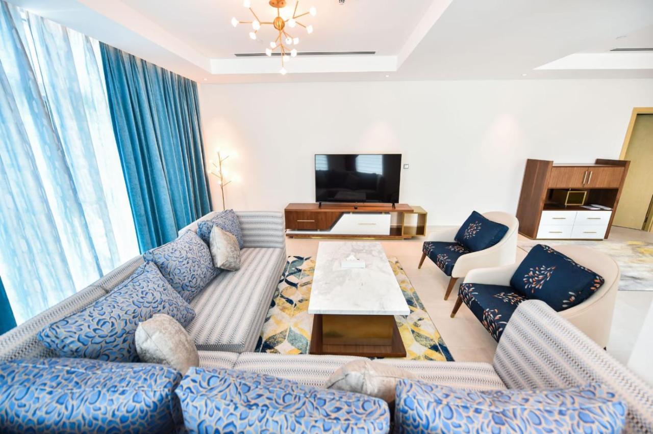 Waterfront Hotel Apartment Lusail Esterno foto A living room in a luxury apartment